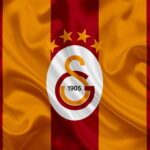 HD-wallpaper-galatasaray-turkish-football-club-emblem-galatasaray-logo-red-yellow-silk-flag-istanbul-turkey-turkish-football-championship